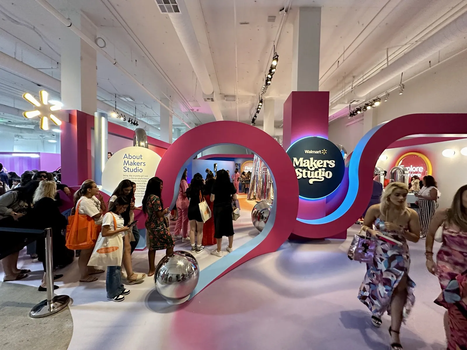 Guests walking through a colorful Makers Studio brand activation