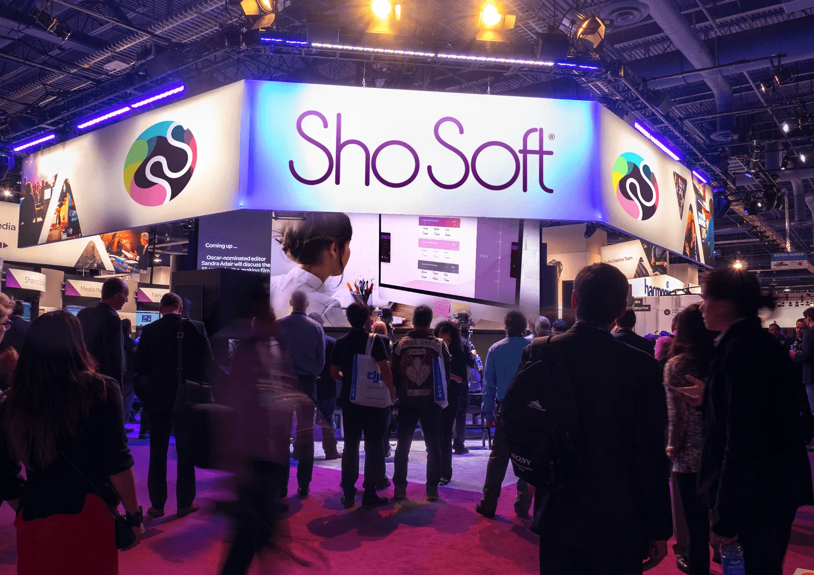Visitors at the ShoSoft booth on a trade show floor